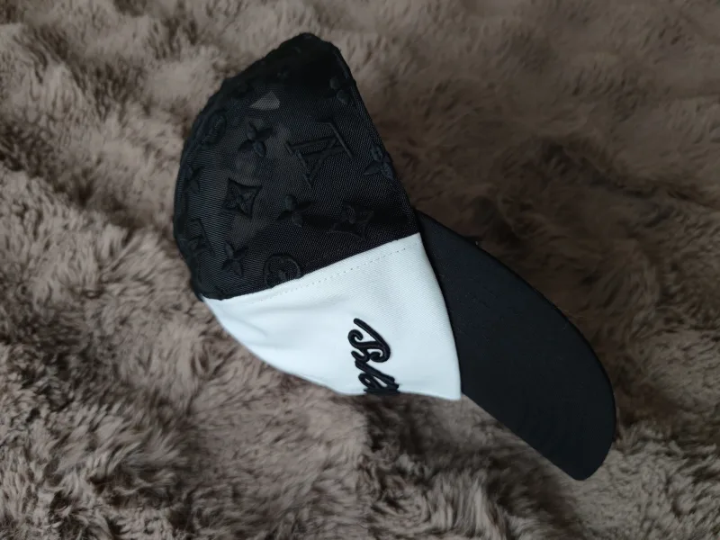 Cap with monogram pattern